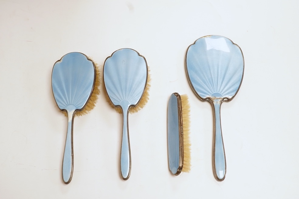 A George V silver and blue guilloche enamel four piece mirror and brush set, Adie Bros. Birmingham, 1935, mirror 28.8cm. Condition - poor